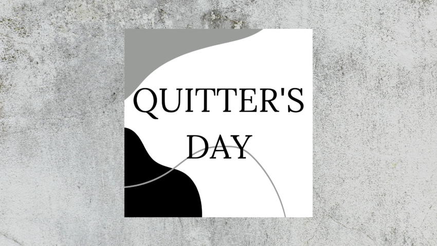 gray marbled background with a black and white abstract design cube overlay. The words "quitter's day" are printed on the cube in bold font.